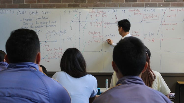 Students learning about mathematics in class