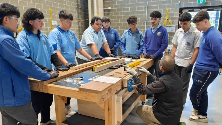 Students listening to an instructor during EPP Construction