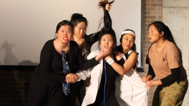 Student group drama performance at the showcase