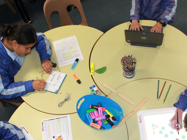 Students working collaboratively around a table