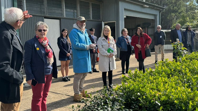 Staff showing guests around on a school tour