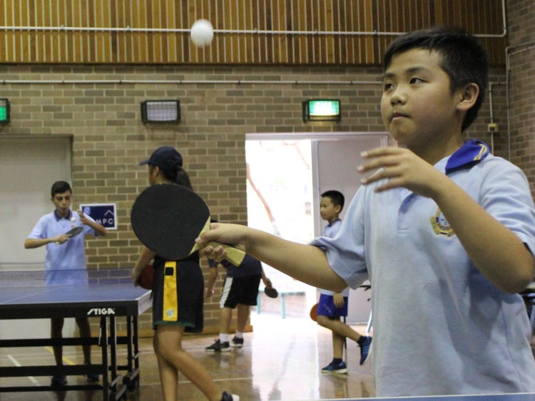A student participating in table tennis training